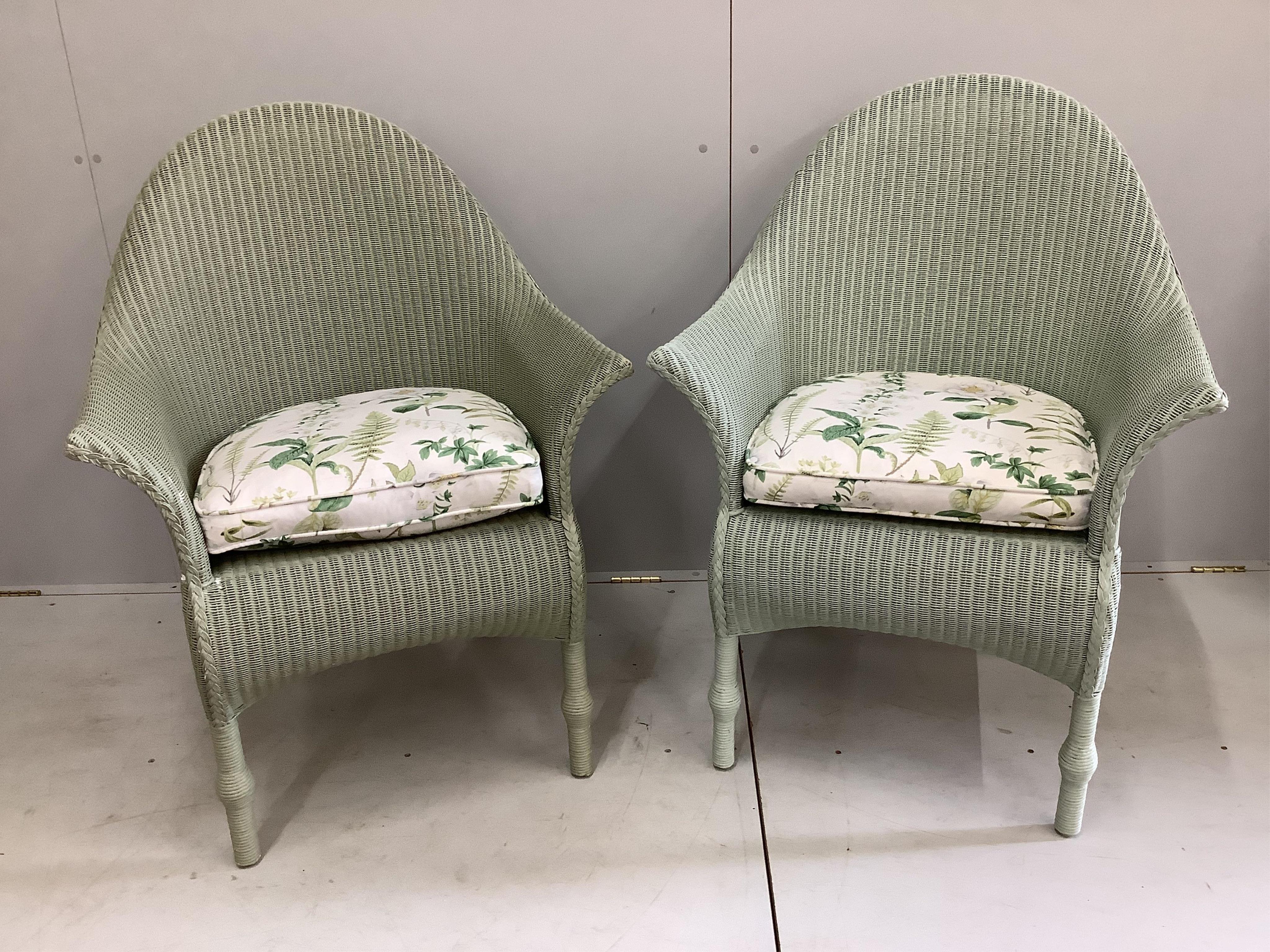 A pair of modern 'Lusty' Lloyd Loom armchairs with loose cushion seats, width 75cm, depth 60cm, height 102cm. Condition - good